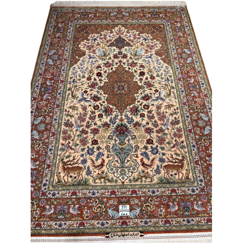 "Handmade Persian rug with intricate deer and bird motifs, traditional Persian floral designs, and silk detailing."
