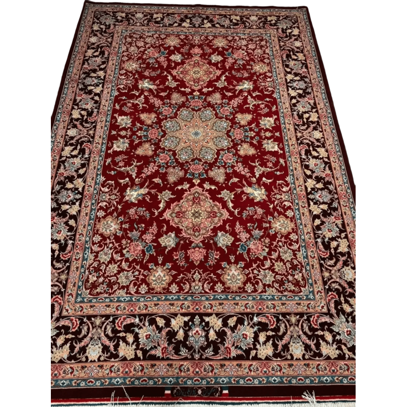 An Isfahan Persian rug featuring intricate red and blue patterns