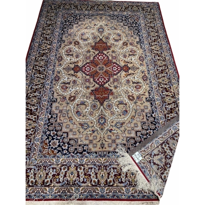 Handwoven Persian rug in beige, burgundy, and navy tones.