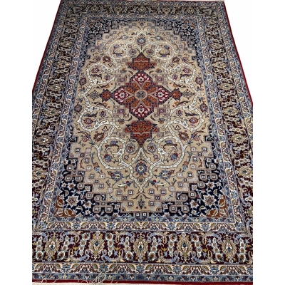 Vintage Persian Isfahan rug with medallion and geometric designs.