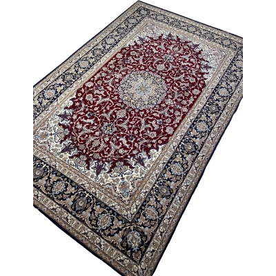 Traditional Persian medallion rug with intricate details.