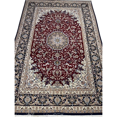 Persian Isfahan rug with deep crimson red and ivory floral design.
