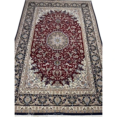 Persian Isfahan rug with deep crimson red and ivory floral design.
