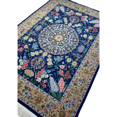 "Limited edition blue Persian rug, with a floral pattern, made of wool and silk, handwoven in Isfahan, 7.2 x 5 feet in size."