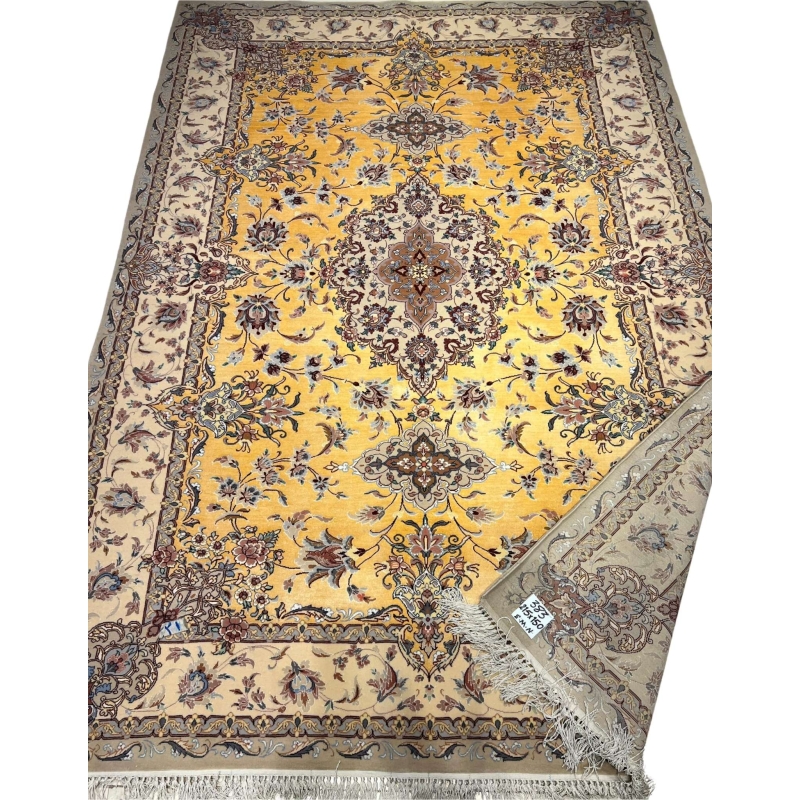 Luxurious beige and yellow silk rug with decorative motifs