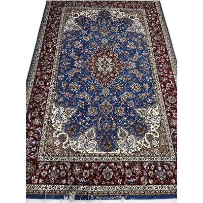 "Knotted wool and silk Persian rug with intricate floral and geometric patterns from Isfahan."