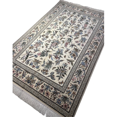 "Exquisite silk and wool Persian carpet – luxury hand-knotted Isfahan rug with natural bird and floral patterns."