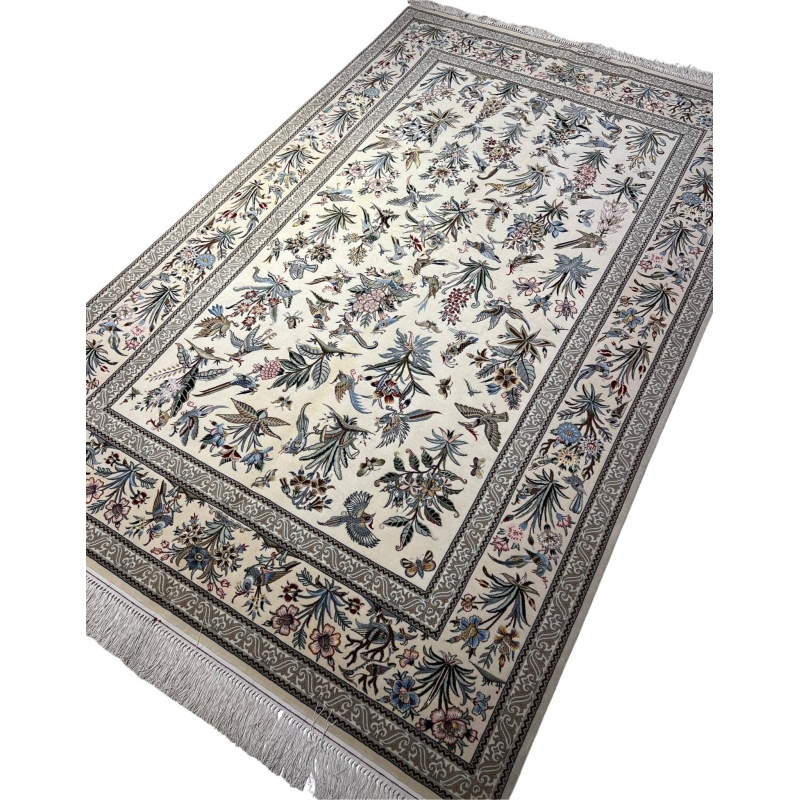 "Exquisite silk and wool Persian carpet – luxury hand-knotted Isfahan rug with natural bird and floral patterns."