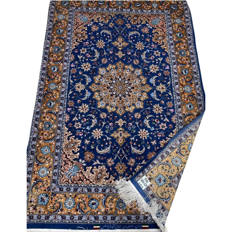 "Hand-knotted Persian rug made with wool and silk by master weaver Hojehfroosh."
