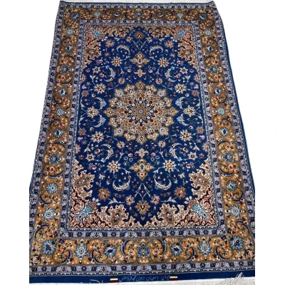 "Authentic handcrafted Persian rug from Isfahan with intricate floral and geometric patterns."
