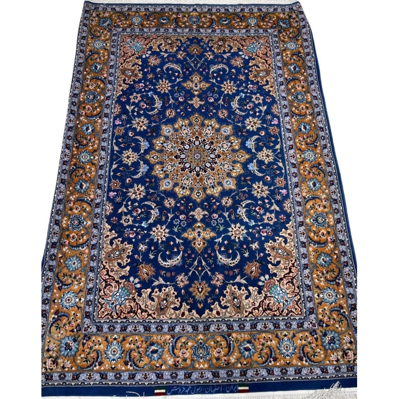 "Authentic handcrafted Persian rug from Isfahan with intricate floral and geometric patterns."