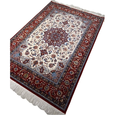 "Hand-knotted Persian rug with detailed central medallion and red borders by Hojeh Froosh."