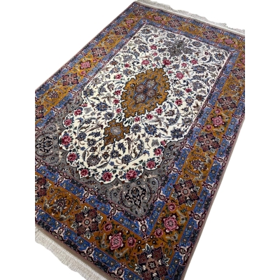 Floral-patterned Persian rug with vibrant borders in golden and blue.