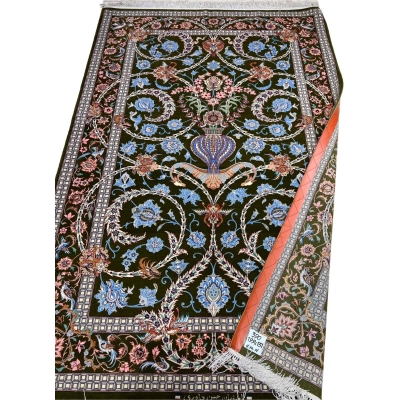 Handwoven Persian rug with intricate floral patterns.