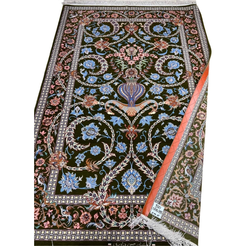 Handwoven Persian rug with intricate floral patterns.