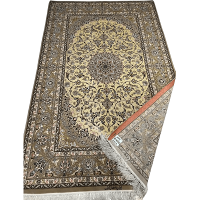 Close-up of New Isfahan Rug showcasing its detailed gold and beige 810,000 knot design