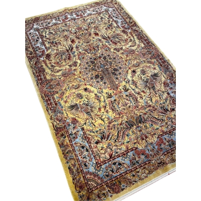 "Authentic Persian wool and silk rug featuring a phoenix and floral motif, ideal for elegant interiors and collectors."