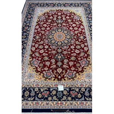Hand-knotted red and black Persian rug with floral design by Jafar Fakhforie