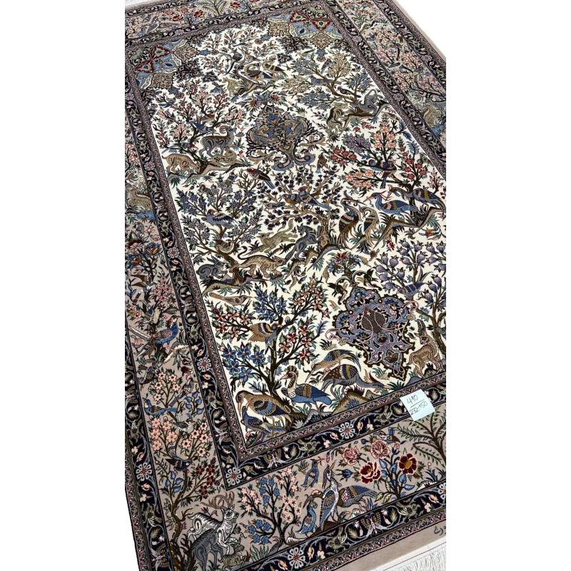 "Traditional Persian hand-knotted carpet with intricate animal motifs, floral patterns, and a luxurious silk warp."
