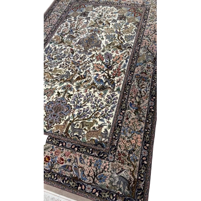 "Handwoven Isfahan Persian rug with silk and wool, showcasing a detailed hunting scene with birds, deer, and floral patterns."