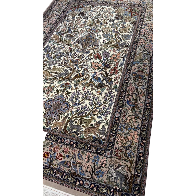 "Handwoven Isfahan Persian rug with silk and wool, showcasing a detailed hunting scene with birds, deer, and floral patterns."