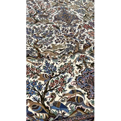 "Exquisite Persian carpet from Isfahan, featuring a classic hunting design, intricate hand-knotting, and luxurious silk accents."