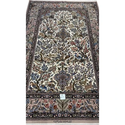 "Isfahan Persian hunting scene rug with hand-knotted silk and wool design featuring birds and deer, 232 x 150 cm."