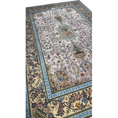 "Handmade Persian Isfahan rug featuring a detailed flower vase design and vibrant blue borders."