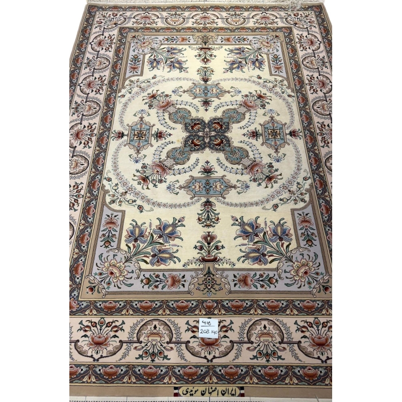 "Persian Isfahan rug with intricate floral and geometric patterns, hand-knotted by Master Moaeedie in silk and wool."