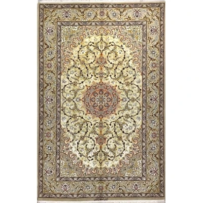 "Elegant Isfahan Persian rug featuring a floral medallion, hand-knotted by Abteen."
