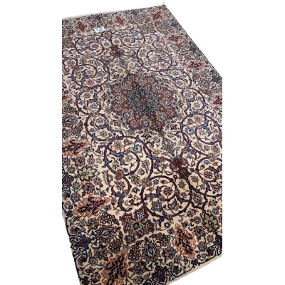 "Hand-knotted 70-year-old Isfahan rug, made with wool and silk."