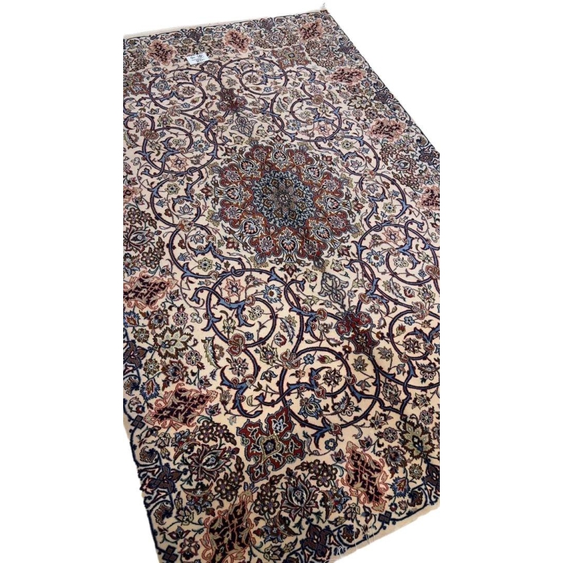 "Hand-knotted 70-year-old Isfahan rug, made with wool and silk."