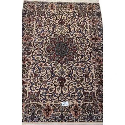 "Semi-antique Isfahan Persian rug with beige, red, and blue floral motifs."
