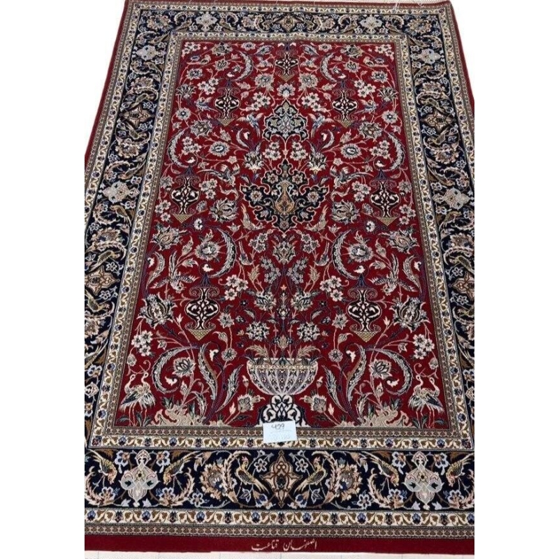 "Hand-knotted Isfahan Persian rug crafted by Ghenaat, featuring wool and silk in a luxurious red and black design. Measuring 170 cm x 110 cm (5.6 ft x 3.6 ft) with a knot density of 810,000 knots per square meter, this exquisite Persian carpet showcases intricate craftsmanship. Available for purchase online with only one rug in stock."