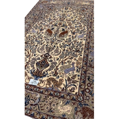"Textured surface of antique Isfahan rug with intricate knot count"