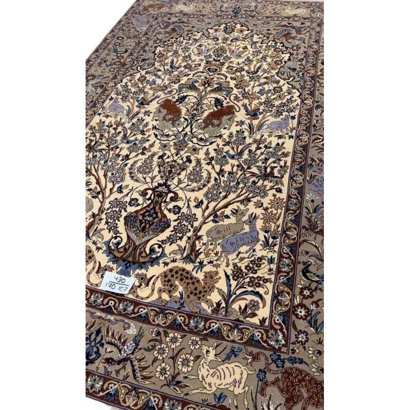 "Textured surface of antique Isfahan rug with intricate knot count"