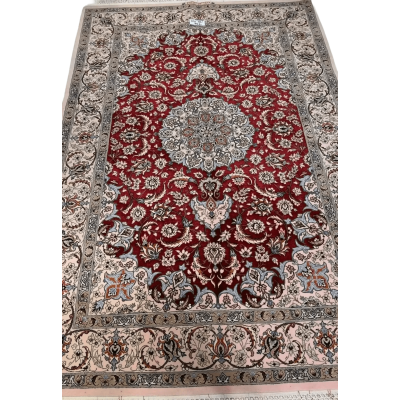 "Authentic Isfahan Persian rug woven by master artisan Taghiezadeh. This silk and wool area rug, measuring 170 cm x 107 cm, offers intricate craftsmanship with a knot density of 810,000 knots per square meter. Buy this luxurious Persian carpet online to add elegance to any space."