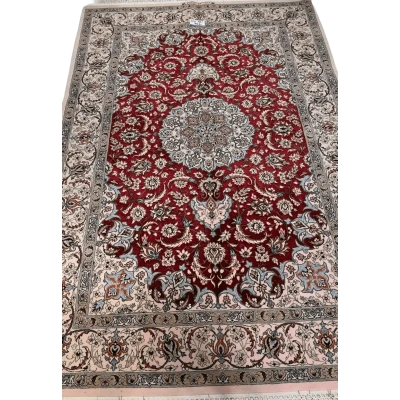 "Authentic Isfahan Persian rug woven by master artisan Taghiezadeh. This silk and wool area rug, measuring 170 cm x 107 cm, offers intricate craftsmanship with a knot density of 810,000 knots per square meter. Buy this luxurious Persian carpet online to add elegance to any space."