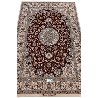 "Hand-knotted luxury Isfahan Persian rug crafted by renowned Taghiezadeh. This exquisite silk and wool Persian rug measures 170 cm x 107 cm (5.6 ft x 3.5 ft), featuring a knot density of 810,000 knots per square meter. Elevate your home decor with this authentic Persian carpet, available online, with only one piece in stock."