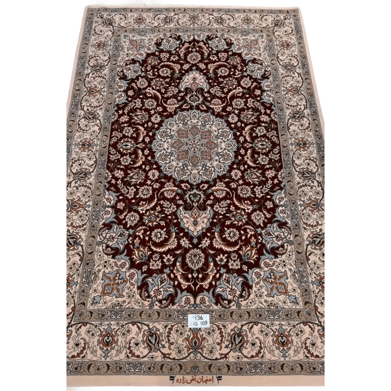 "Hand-knotted luxury Isfahan Persian rug crafted by renowned Taghiezadeh. This exquisite silk and wool Persian rug measures 170 cm x 107 cm (5.6 ft x 3.5 ft), featuring a knot density of 810,000 knots per square meter. Elevate your home decor with this authentic Persian carpet, available online, with only one piece in stock."