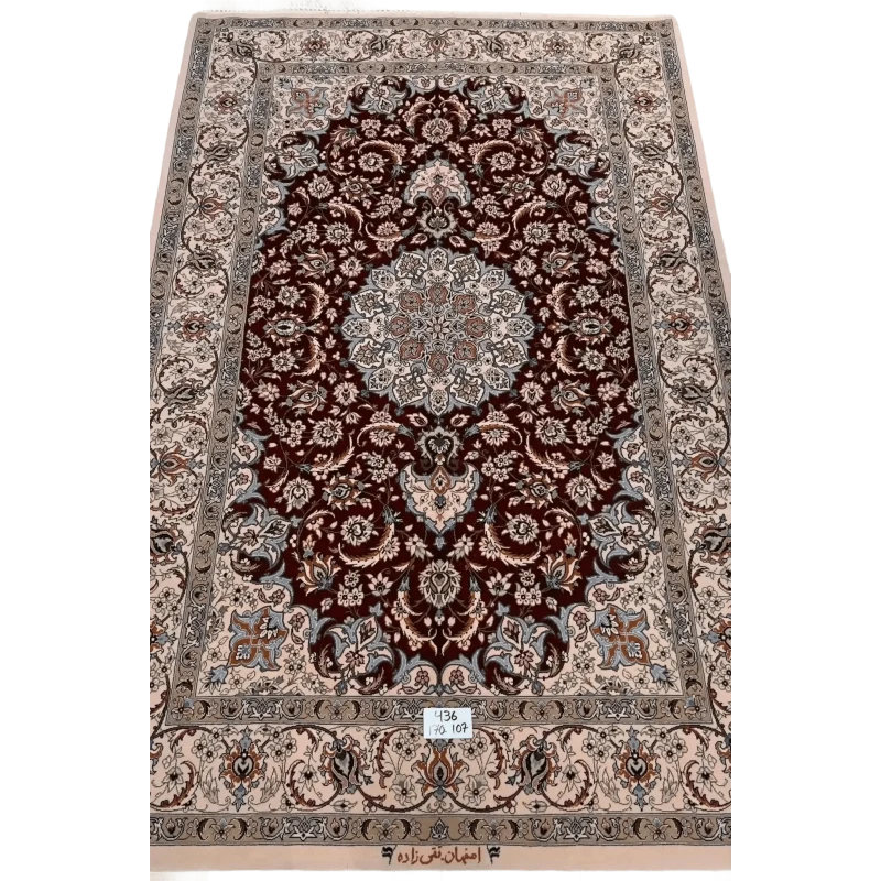 "Hand-knotted luxury Isfahan Persian rug crafted by renowned Taghiezadeh. This exquisite silk and wool Persian rug measures 170 cm x 107 cm (5.6 ft x 3.5 ft), featuring a knot density of 810,000 knots per square meter. Elevate your home decor with this authentic Persian carpet, available online, with only one piece in stock."