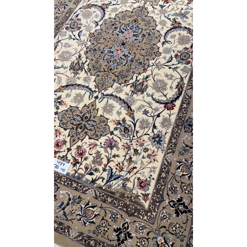 Hand-knotted Persian rug with intricate floral patterns