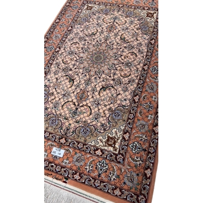 Elegant Isfahan rug featuring a central medallion and soft peach background.