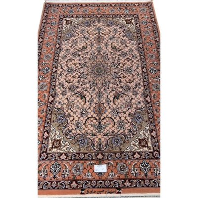 Hand-knotted Persian rug from Isfahan with peach tones and floral motifs.
