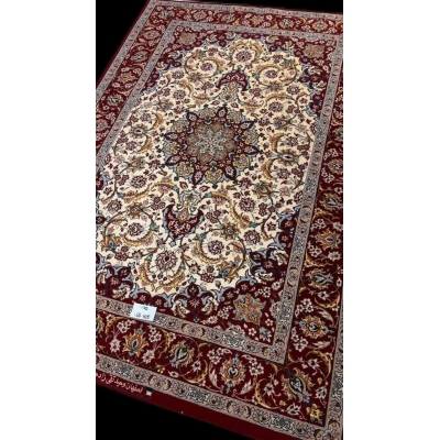 "Elegant wool and silk Persian rug from Isfahan, hand-knotted by master weaver Taghiezadeh. This luxurious 166 cm x 105 cm rug adds timeless beauty to any space."
