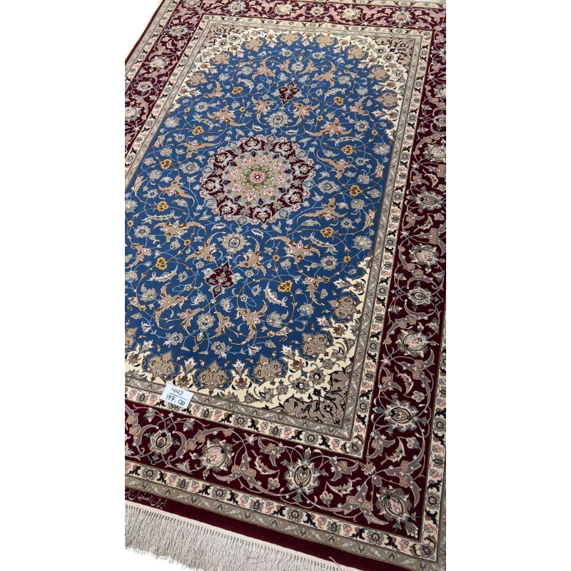 Classic Persian rug in red and blue with a central medallion and floral motifs