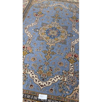 "Luxurious wool and silk Isfahan rug featuring a detailed medallion and floral motifs."