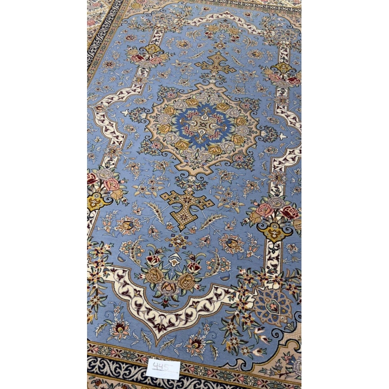 "Luxurious wool and silk Isfahan rug featuring a detailed medallion and floral motifs."