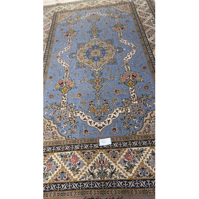 "Elegant Persian hand-knotted rug in shades of blue and cream, perfect for sophisticated interiors."