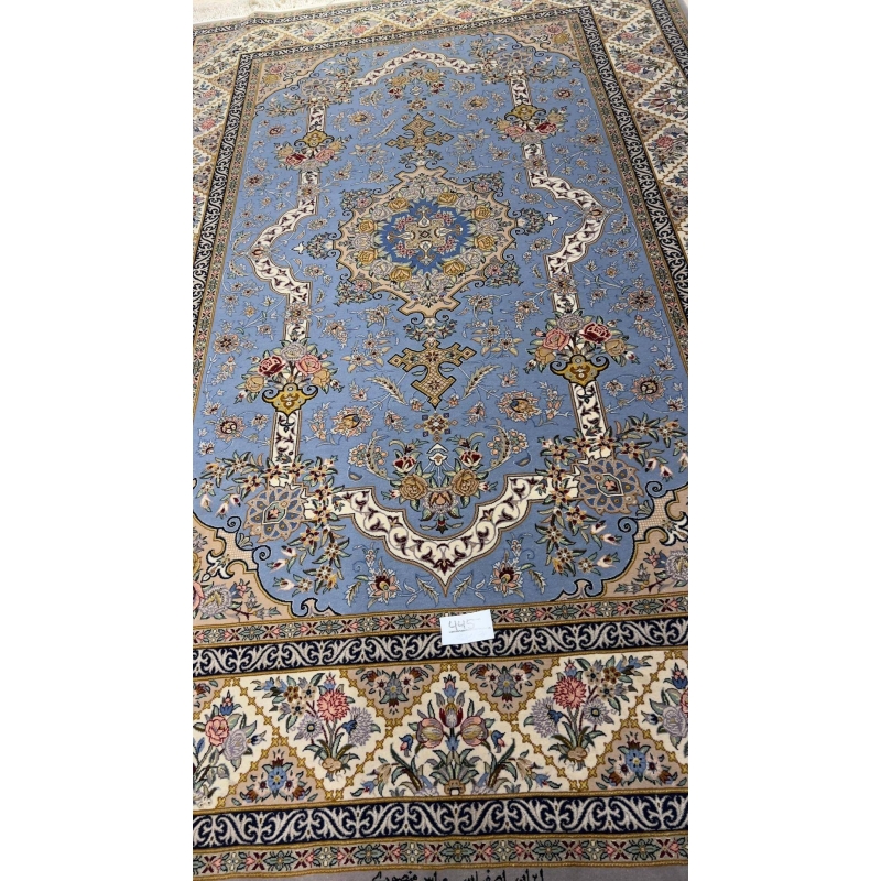 "Elegant Persian hand-knotted rug in shades of blue and cream, perfect for sophisticated interiors."